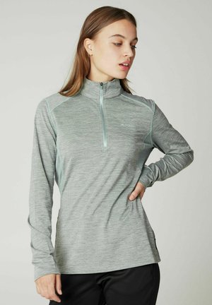 Grijze long-sleeve zip-up shirt met een hoge kraag, met een textuurpatroon en contrasterende lichtblauwe accenten langs de naden.