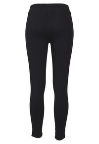 Fekete leggings sima textúrával, magas derékkal és testhez simuló kivitelben. Egyszerű, mintázat vagy figyelemfelkeltő fémrészletek nélkül.