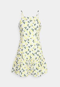 Robe sans manches en coton jaune et blanc, ornée d'un motif de citrons et de feuilles vertes, avec un ourlet volanté et des bretelles spaghetti réglables.