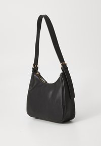 Black leather shoulder bag with a curved shape and adjustable strap, featuring a gold-tone zipper and smooth texture.