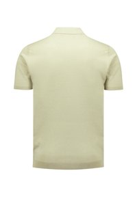 Polo shirt in lichtbeige, korte mouwen, gebreide textuur, ribbelkraag en -zoom, eenvoudig ontwerp zonder zichtbare logo's of patronen.