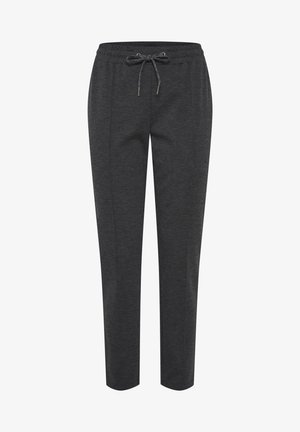 Tumedat hallid spordipüksid, mis on valmistatud pehmest materjalist, elastse vöökoha ja nööriga, küljetaskute ning kitseneva jala kujundusega.