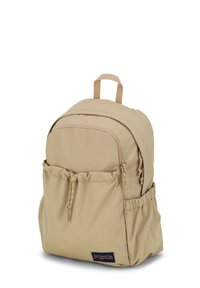 Sac à dos en tissu beige de forme arrondie, avec une poche zippée à l'avant, une poche latérale à cordon et une poignée de transport en haut. Badge logo sur le bas du devant.