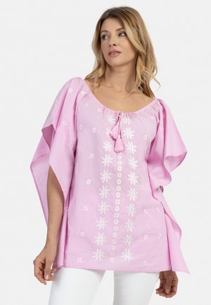 Roze geborduurde tuniek met een wijd decollet&eacute; en een decoratieve kwast, korte mouwen en bloemenpatronen aan de voorkant. Zachte, lichte stof.