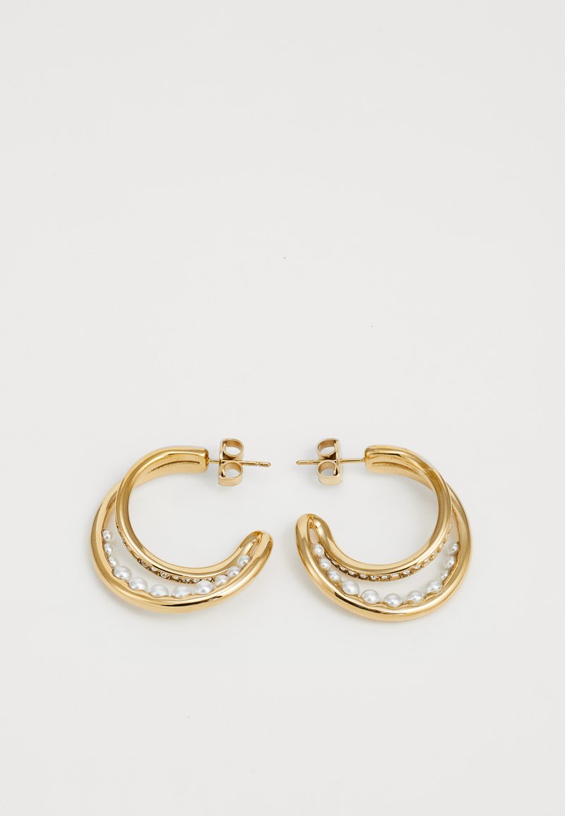 Gold hoop earrings with a curved design, featuring a row of small white pearls and clear gems along the lower edge.