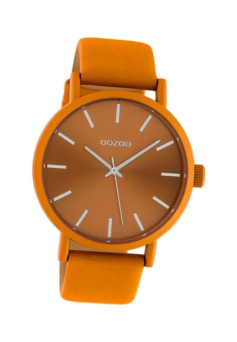 Orange silicone watch with a matte finish, round dial, white hour markers, and a matching strap. Brand name "OOZOO" on the dial.