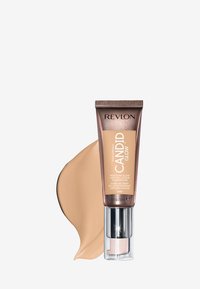 Fondotinta Revlon Candid Glow in un tubo bronzo con pompa, che mostra una campionatura di fondotinta beige. Presenta affermazioni di protezione contro l'inquinamento.