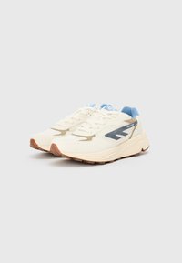 White and blue athletic shoes with a textured upper, featuring beige accents, a padded collar, and a rubber sole with grip patterns.