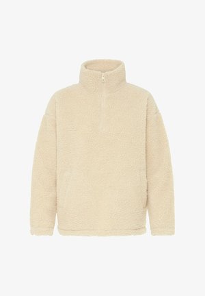 Krämfärgad fleecetröja med hög krage och kvartszip. Har en mjuk, strukturerad yta och avslappnad passform. Inga synliga stängningar.