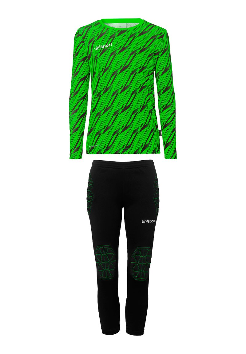 Haut à manches longues vert avec un motif en zigzag noir et vert, associé à un pantalon noir avec des accents verts et une protection des genoux rembourrée.