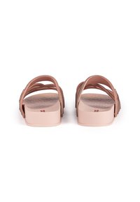 Pink slide sandals featuring a textured footbed and dual elastic straps with decorative accents. The sole is flat and wide for stability.