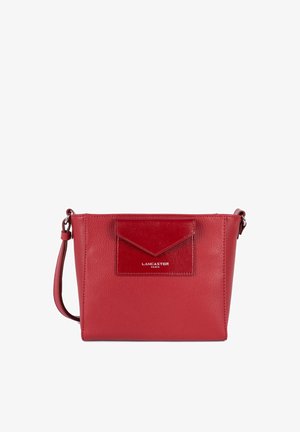 Red leather crossbody bag with a textured front pocket, smooth finish, adjustable strap, and embossed "Lancaster Paris" logo.