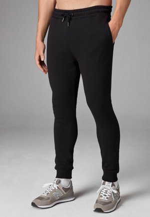 JOGGERS - Jogginghose - black