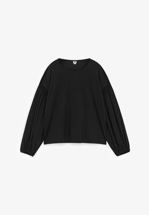 Black long-sleeve top made of cotton. Features a round neckline, loose fit, and gathered sleeves for added volume. Simple design, no patterns.