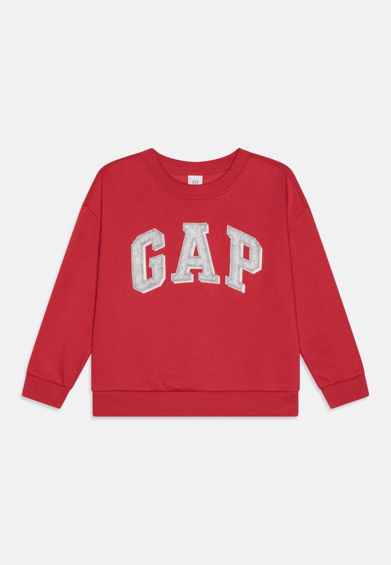 Sarkana džemperis ar baltām blokiem burtiem "GAP" uz krūtīm, garām piedurknēm, apaļu kakla izgriezumu, ribotām aprocēm un apakšmalu. Maiga tekstūra.