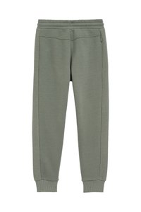 Zelené teplákové nohavice z jemného materiálu s rebrovanými manžetami. Obsahujú textúrované bočné panely s geometrickými vzormi a elastický pás.