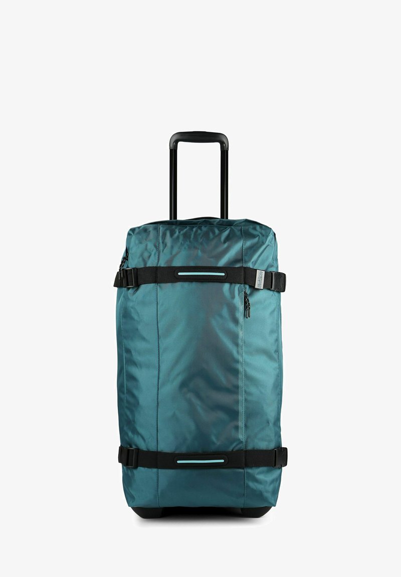 Sac de voyage à roulettes bleu sarcelle avec des sangles noires réglables, une poche latérale zippée et une poignée noire extensible.