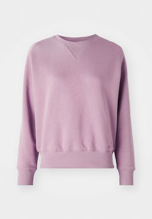 Felpa viola in morbido tessuto; presenta un collo a costine, maniche lunghe e polsini elasticizzati. Dettaglio del logo discreto sull'orlo.