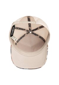 Beige cap with a patterned brim, featuring a mesh interior, Goorin branding inside, and a flat, structured shape for a secure fit.