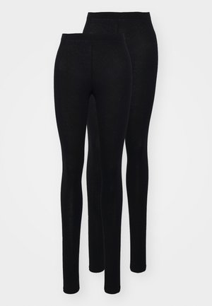 Leggings noirs en tissu lisse et extensible avec une taille haute. Présente une silhouette ajustée et un design longueur cheville. Deux paires exposées.