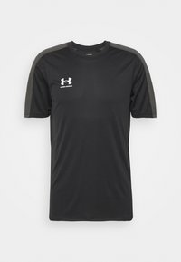 Black short-sleeve athletic shirt made of smooth fabric, featuring gray accents on shoulders and a white Under Armour logo on the chest.
