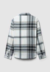 Camicia a maniche lunghe con motivo a quadri nero, grigio e bianco, con polsini bottonati e colletto, mostrata dal retro su uno sfondo neutro.