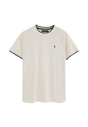 Cremefarbenes T-Shirt mit kurzen Ärmeln und schwarzem Besatz am Kragen und an den Ärmeln, kleines schwarzes Polo-Spieler-Logo auf der linken Brust.