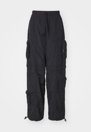 Black cargo pants made of lightweight material, featuring multiple zippered pockets, an elastic waistband, and adjustable ankle cuffs.