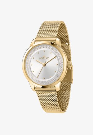 Orologio tondo in oro con quadrante argentato, cinturino in maglia e accenti di cristallo attorno al bezels. Presenta indici delle ore minimalisti e lancette dorate.