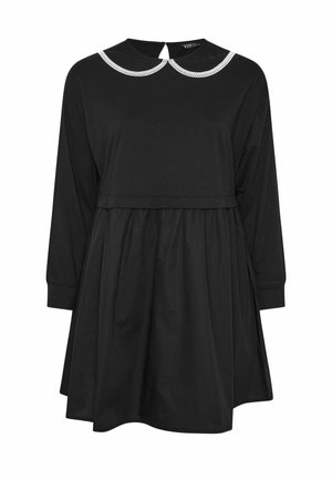 Abito nero con maniche lunghe, gonna arricciata e colletto rotondo bianco. Presenta una chiusura a chiave sul retro. Tessuto morbido e textured.