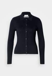 Námornícky pruhovaný kardigán s golierom, dlhými rukávmi a gombíkovým zapínaním. Vyrobený z jemného materiálu s jemným leskom.