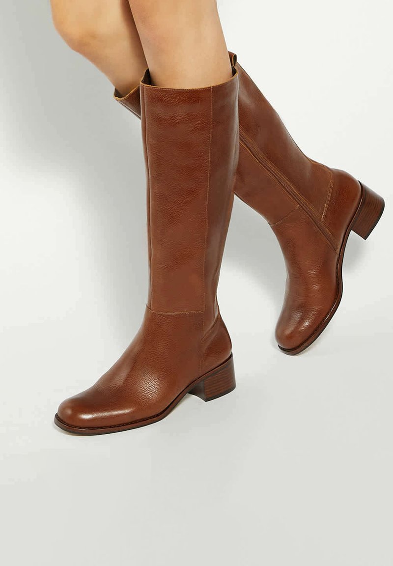 Brown leather knee-high boots with a smooth texture, square toe, and stacked heel. Side zipper detail for easy wear.