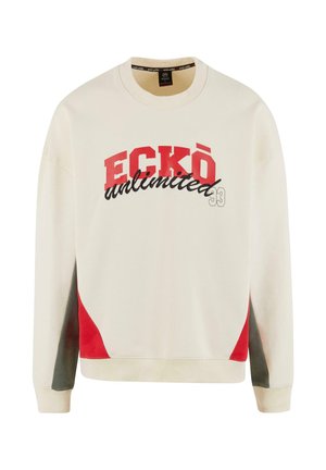 Krémová mikina s nápisem "ECKŌ unlimited" v červeném a černém písmu. Má červené a šedé akcenty po stranách. Kulatý výstřih a dlouhé rukávy. Směs bavlny.