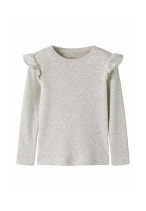 Chemise enfant gris clair à manches longues avec petit motif cœur et détails volantés aux épaules.