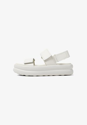 Weiße Plateau-Sandalen mit zwei verstellbaren Klettverschlüssen. Aus glattem synthetischem Material gefertigt. Weiche, abgerundete Kanten mit einer strukturierten Sohle.