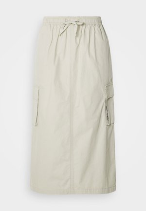 Light beige cargo skirt with an elastic waistband and drawstring, featuring two side pockets and a straight cut design. Smooth fabric texture.