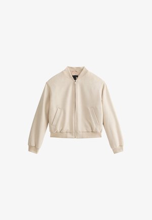 Beige bomber jacket with a zip closure, ribbed cuffs, and two front pockets. Made of soft fabric with a smooth texture.