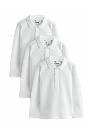 Tre polo bianche semplici a maniche lunghe con colletto, sovrapposte in diverse taglie.