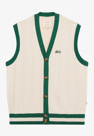 Veste en tricot sans manches crème avec bordure verte, fermeture à boutons, motif en câble vertical, et petit logo brodé vert sur le côté gauche de la poitrine.