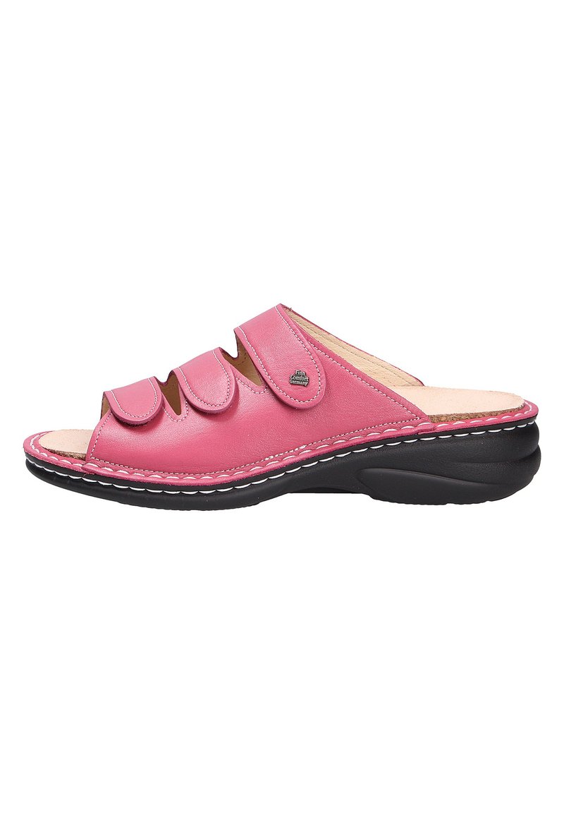 Pink leather slide sandal with three adjustable straps, open toe design, and black rubber sole featuring white stitching details.