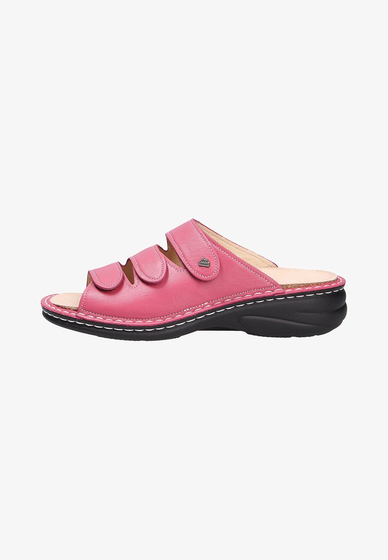Pink leather slide sandal with three adjustable straps, open toe design, and black rubber sole featuring white stitching details.