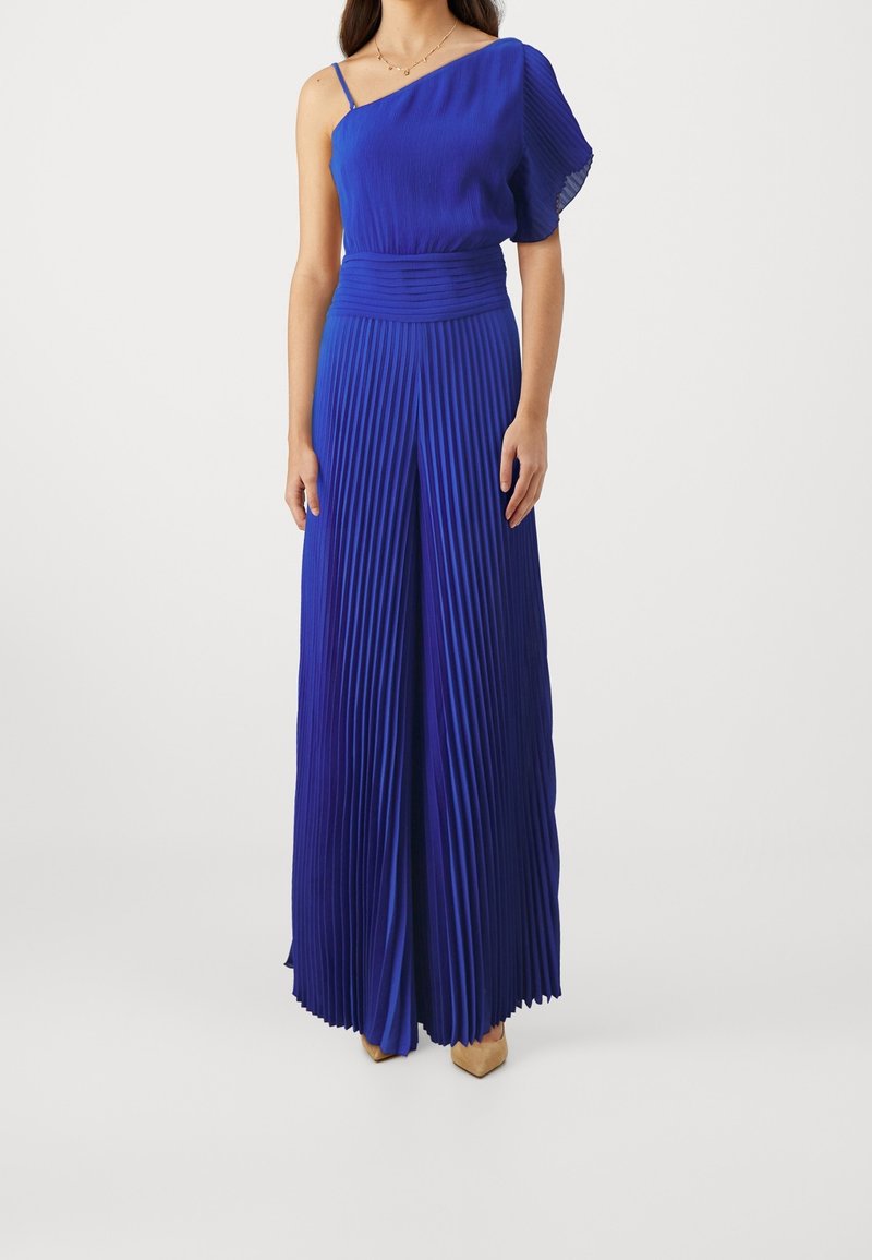 Plisowany, jednofalowy niebieski kombinezon z teksturowanym gorsetem i szerokimi nogawkami, z dopasowaną talią i zwiewnym materiałem.
