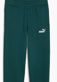 Dark teal joggers with an elastic waistband, side pockets, and a white Puma logo on the left thigh. Soft, textured fabric.