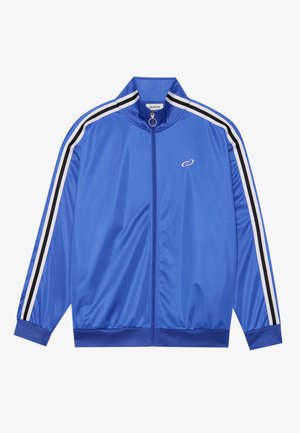 Veste de piste bleue en matériau brillant, avec des accents rayés blancs et noirs le long des manches, col haut et fermeture éclair à l'avant.
