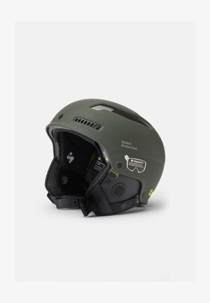 Green ski helmet with a matte finish, adjustable vents, padded interior, and a buckle strap. Features branding and safety certification labels.