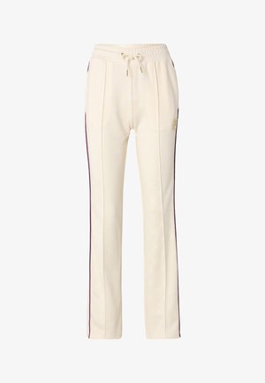 Cream-colored jogger pants with a subtle logo pattern, featuring purple side stripes and an elastic waistband with drawstrings.