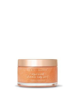Crystallove gekristalliseerde glinsterende lichaamscrème in een doorzichtige pot met een roségouden deksel, met daarin een oranje scrub voor kalmerende en voedende huidverzorging.