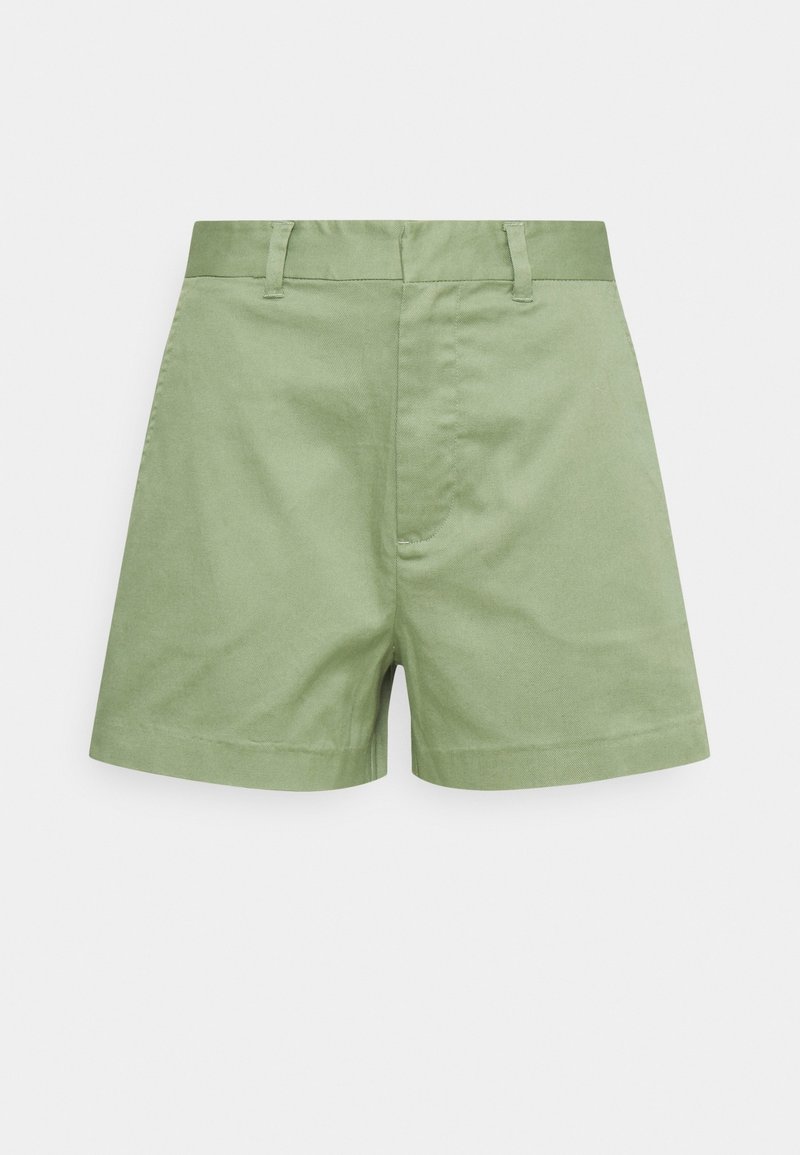 Shorts en coton vert clair avec une coupe droite, un ourlet replié, des passants de ceinture et une fermeture à glissière à l'avant. Pas de motifs ni de graphiques supplémentaires.