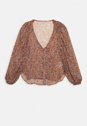 Braune Bluse mit floralen Muster, V-Ausschnitt, langen Puffärmeln, Knopfverschluss und einem leichten, durchsichtigen Stoff mit blauen und weißen Mustern.