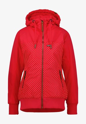 Veste à capuche rouge avec des pois blancs sur la moitié inférieure, dotée d'un zip à l'avant, de cordons ajustables et de poignets côtelés.